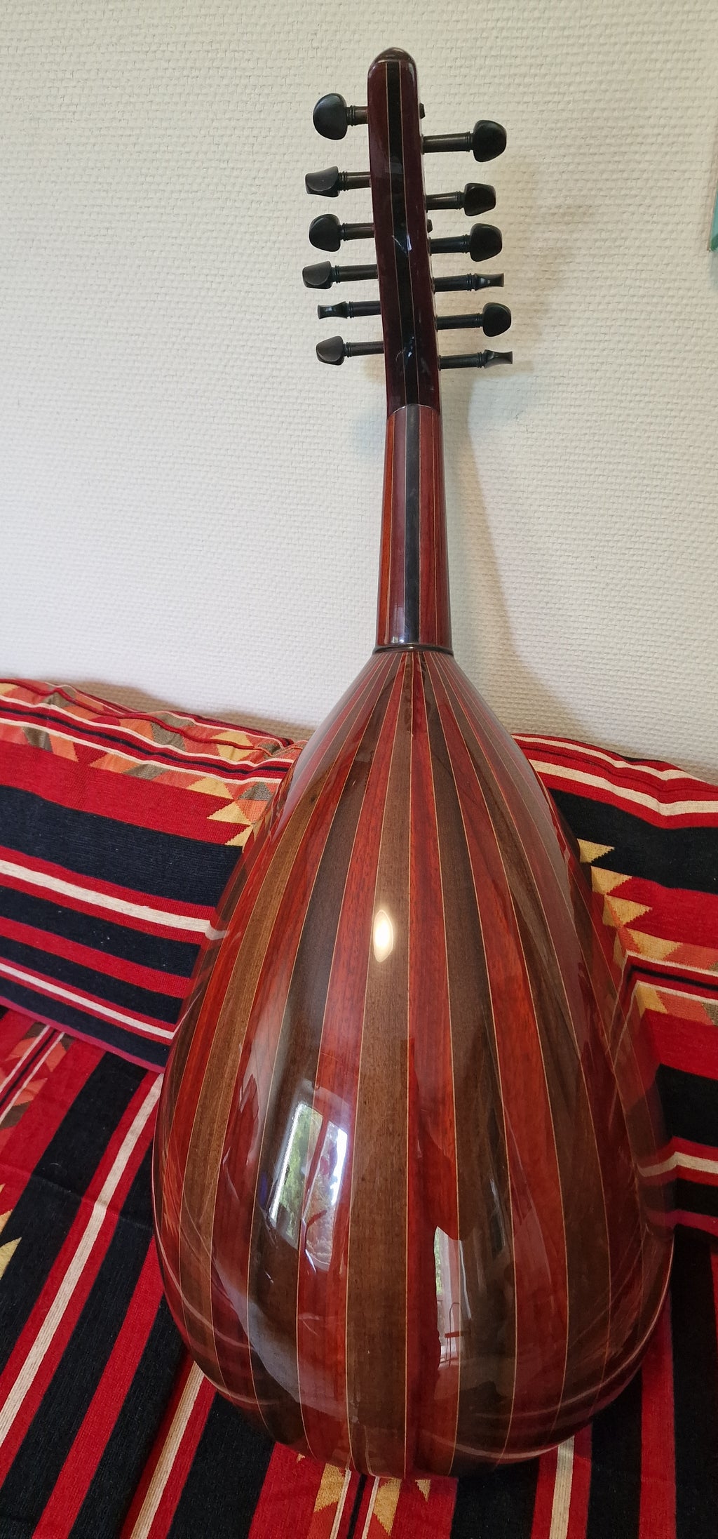 Oud is made from Wenge, rosewood and Walnut which offer nice authentic sound.