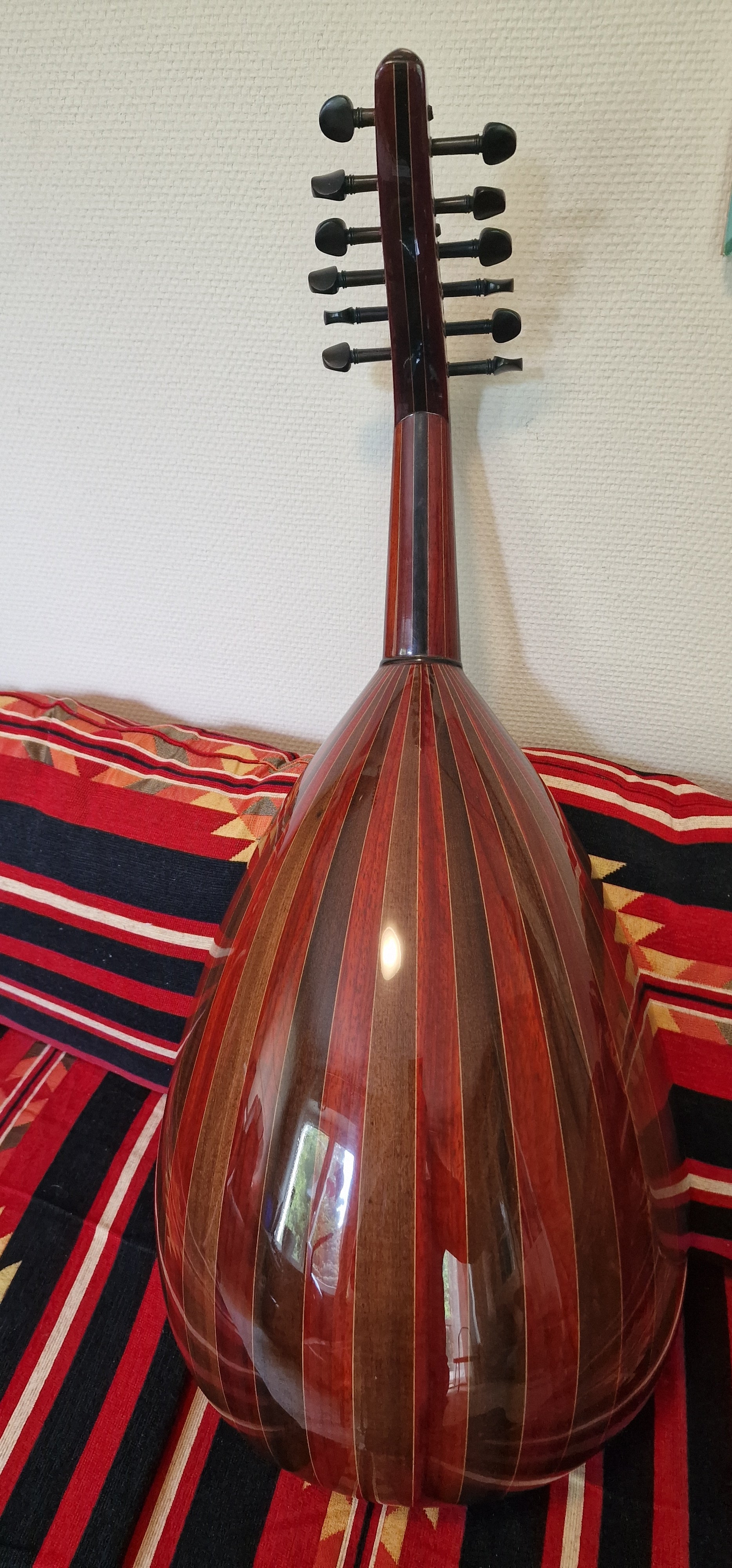 Oud is made from Wenge, rosewood and Walnut which offer nice authentic sound.